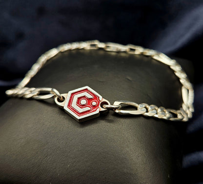 Sterling Silver Figaro Chain Bracelet With Red Catalyst Tag