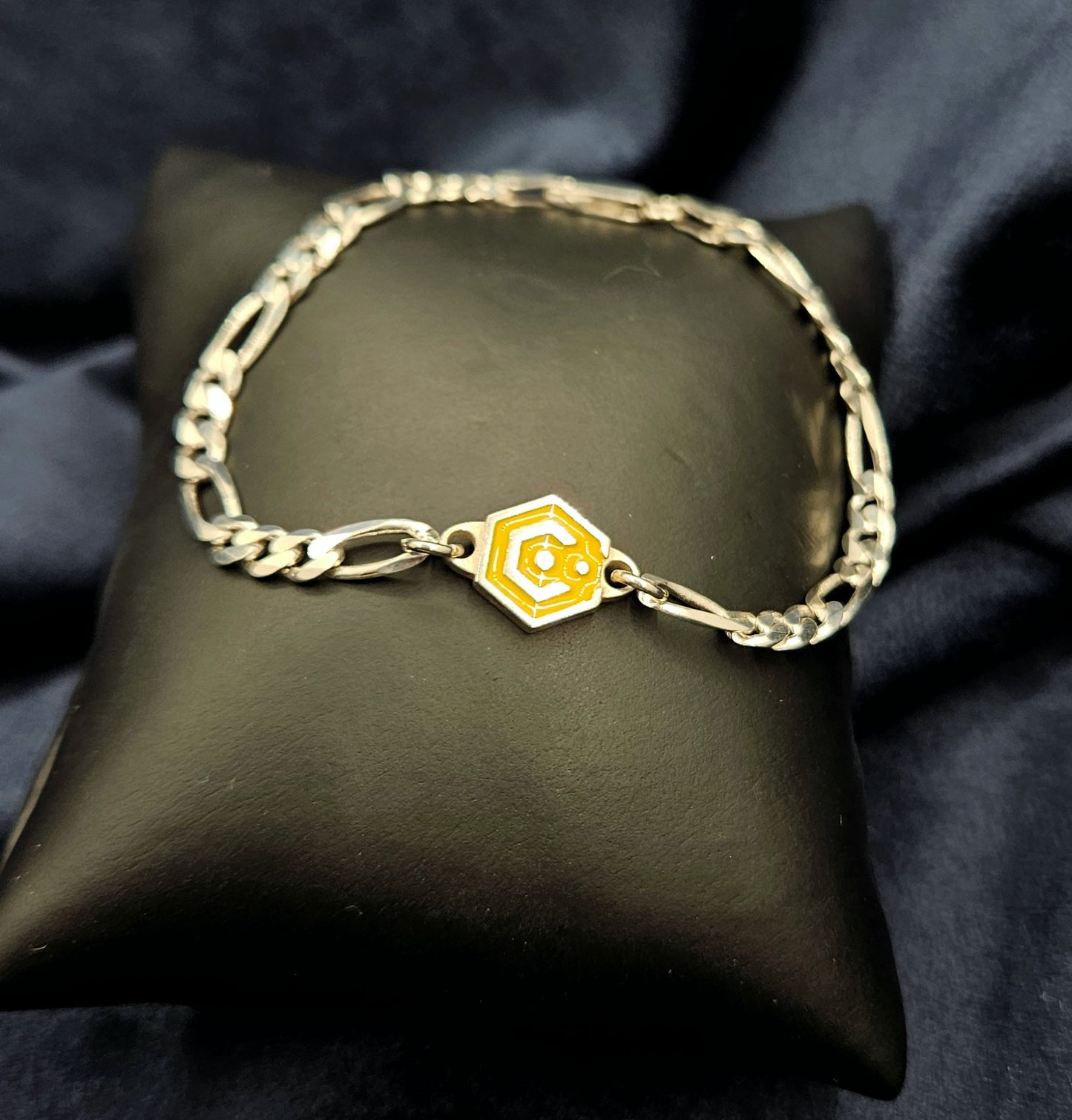 Sterling Silver Figaro Chain Bracelet With Yellow Catalyst Tag